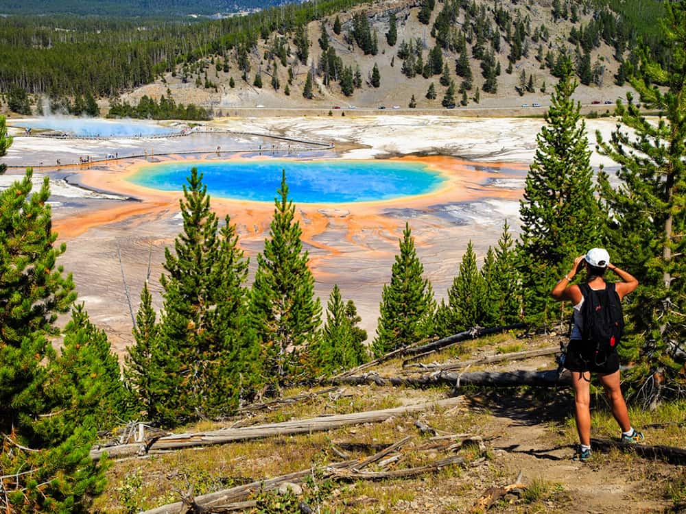Woman watching the Grand Prismatic Spring.