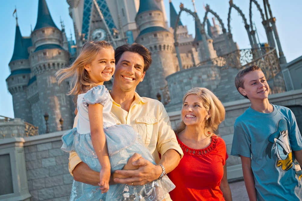 Smiling family in Disneyland.