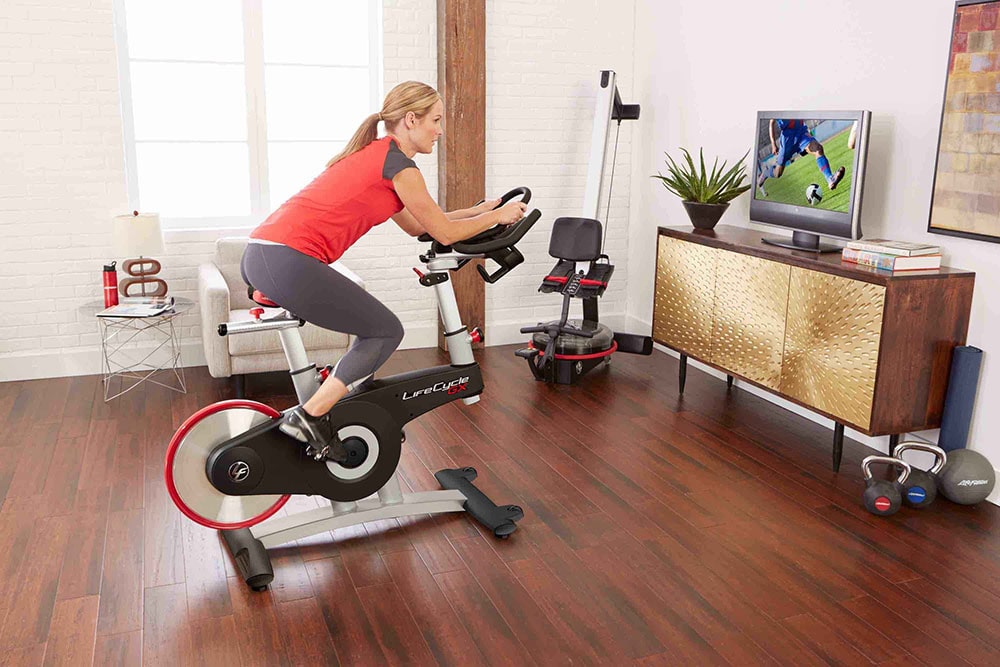 Woman working out on stationary bike.