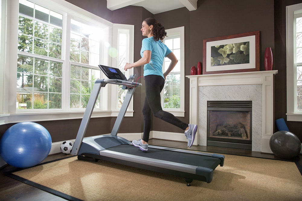 Woman working out on treadmill.