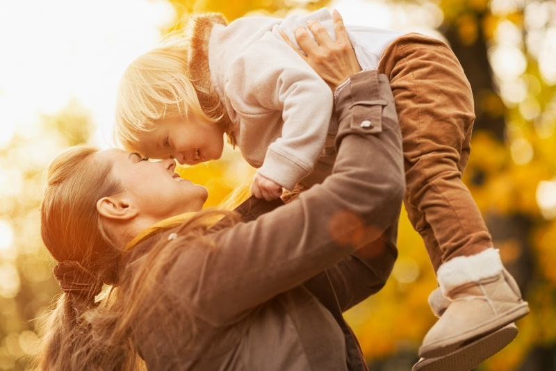 Mother having fun with her little son