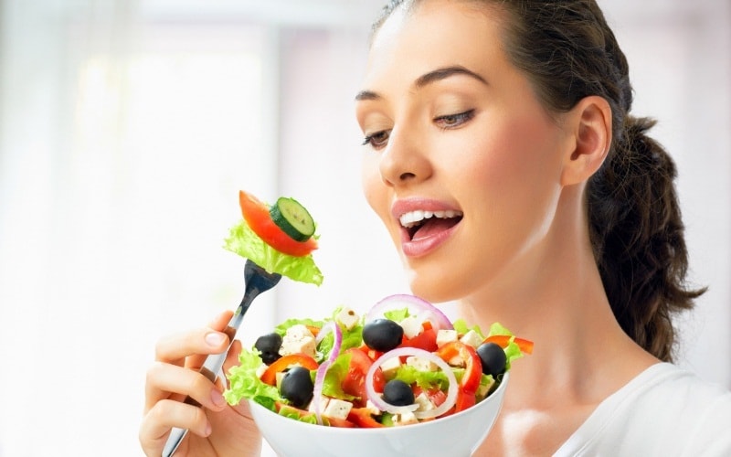 Girl eating salad