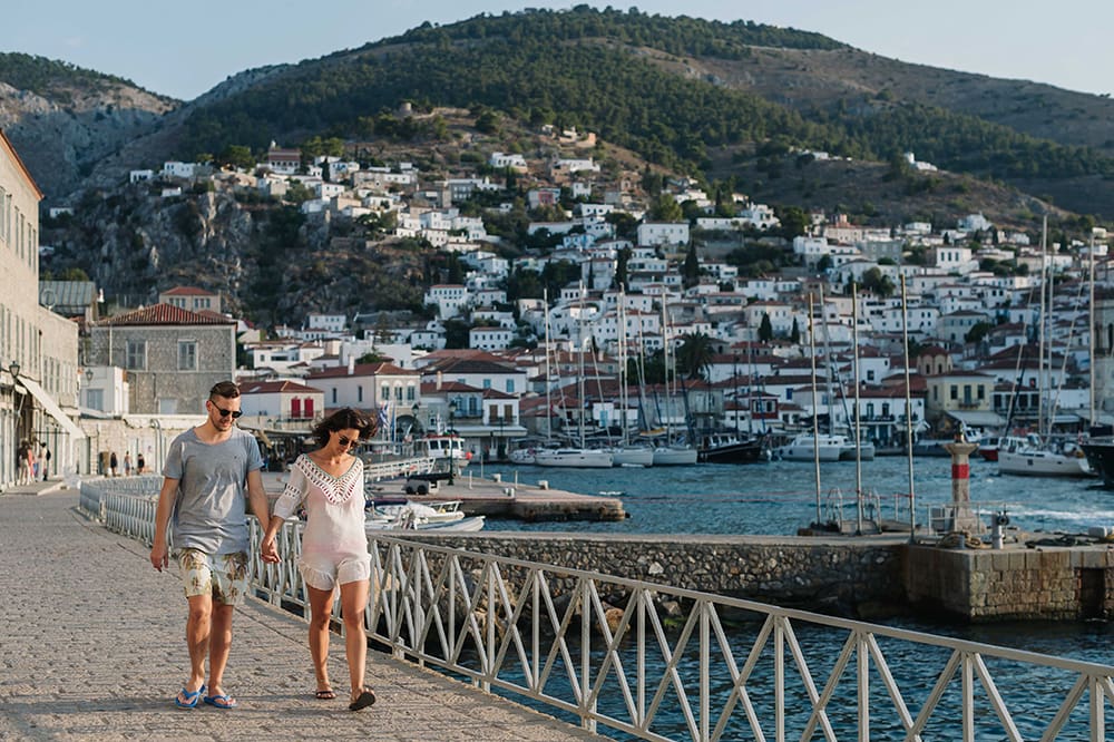 Couple walking at the harbor.