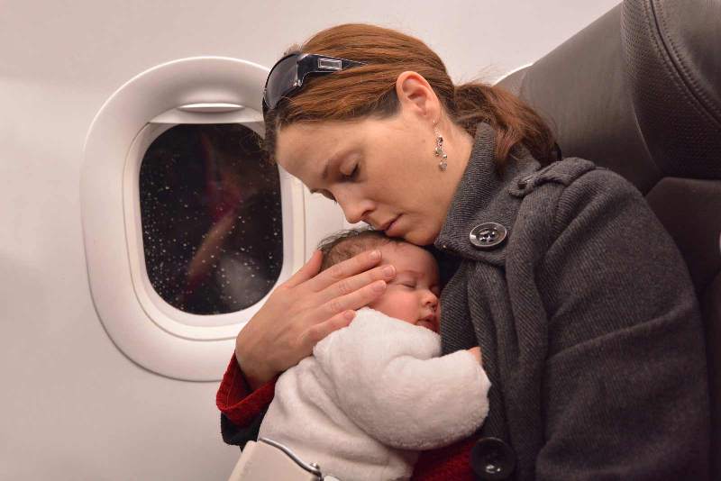 Mother folding a baby to her breast