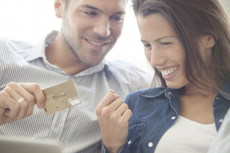 Spouses looking at the credit card