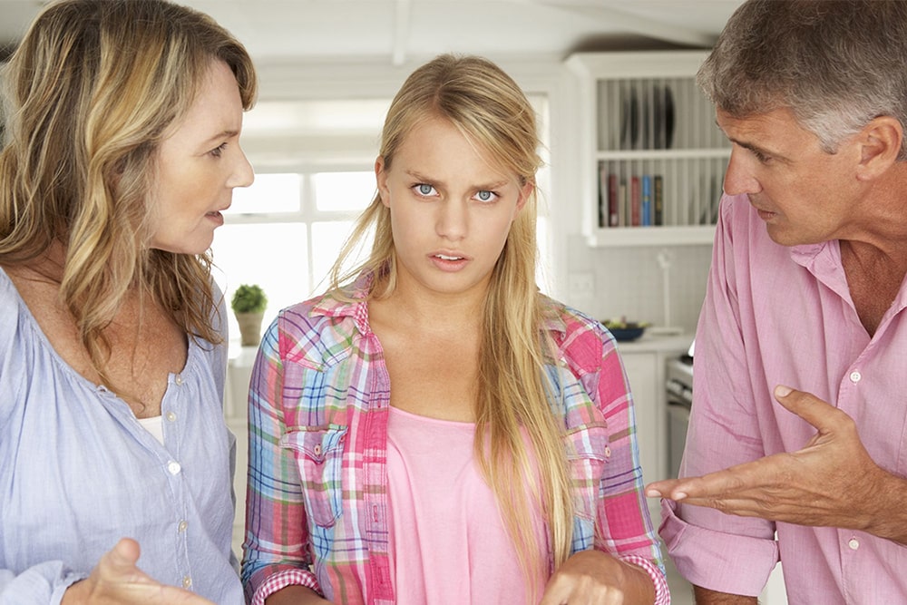 Parents are talking to a teenage daughter.