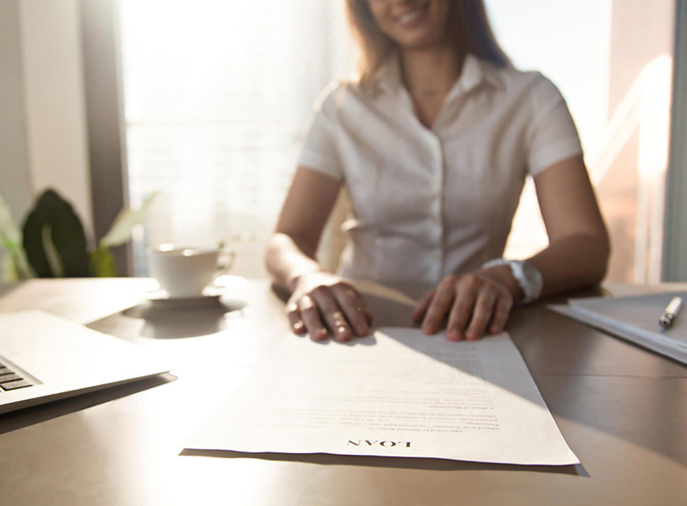 Woman with a loan agreement.