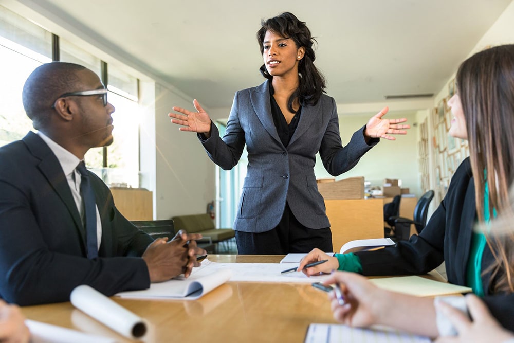 Woman talking to her colleagues.