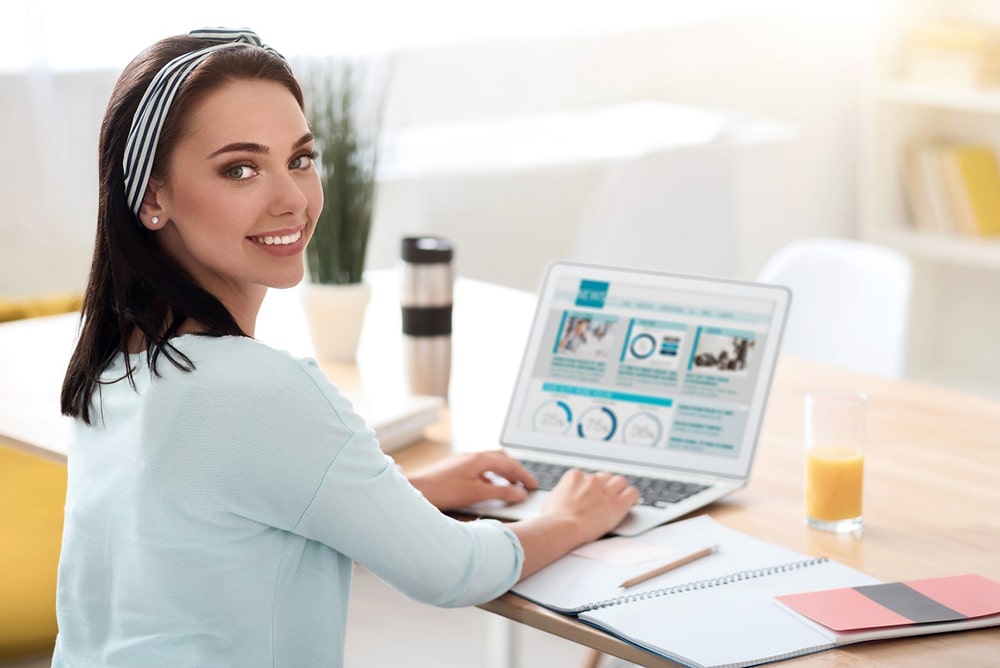 Woman working on her laptop.