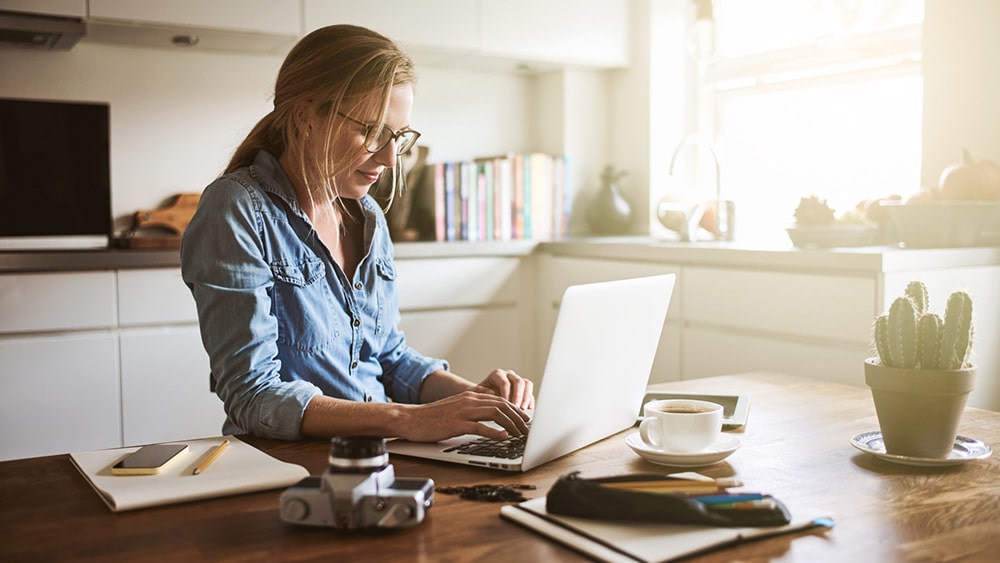 Woman working on her laptop.